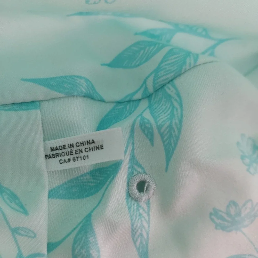 Women's Eddie Bauer floral bucket hat in mint green with aqua blue leaf floral